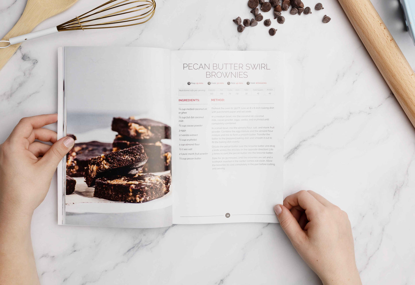 A woman opens to a page in the Diabetes Desserts Cookbook. The recipe is Pecan Butter Swirl Brownies