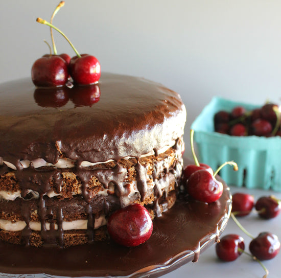 A Sexy Black Forest Cake with cherries as toppings.