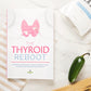 The Thyroid Reboot Book laid on a white plain surface, next to a kitchen cloth, a pack of salt, and a jalapeno  pepper.